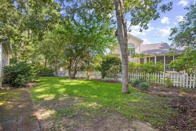 Nestled on a quiet cul-de-sac in The Bluffs at Pawleys Island on Pawleys Plantation Golf and Country Club in South Carolina - for sale on GolfHomes.com, golf home, golf lot