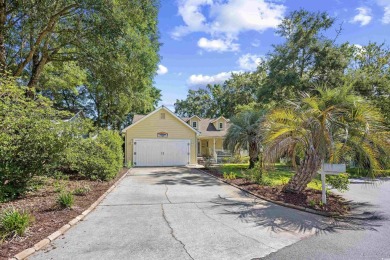 Nestled on a quiet cul-de-sac in The Bluffs at Pawleys Island on Pawleys Plantation Golf and Country Club in South Carolina - for sale on GolfHomes.com, golf home, golf lot