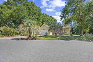 Nestled on a quiet cul-de-sac in The Bluffs at Pawleys Island on Pawleys Plantation Golf and Country Club in South Carolina - for sale on GolfHomes.com, golf home, golf lot