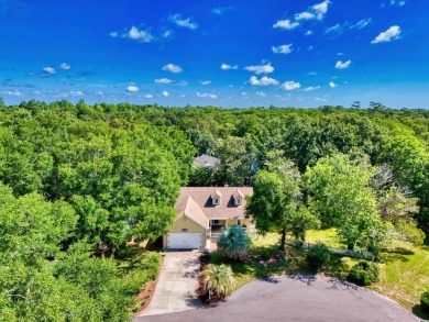Nestled on a quiet cul-de-sac in The Bluffs at Pawleys Island on Pawleys Plantation Golf and Country Club in South Carolina - for sale on GolfHomes.com, golf home, golf lot