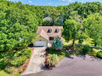 Nestled on a quiet cul-de-sac in The Bluffs at Pawleys Island on Pawleys Plantation Golf and Country Club in South Carolina - for sale on GolfHomes.com, golf home, golf lot