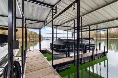 Lakefront condo with a deeded boat slip and boat for under on Stone Creek Cove Golf Course in South Carolina - for sale on GolfHomes.com, golf home, golf lot