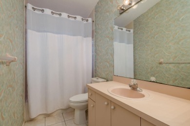 Welcome to this spacious three-bedroom on East Lake Woodlands Country Club in Florida - for sale on GolfHomes.com, golf home, golf lot