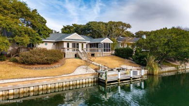 Tucked away on a quiet, canal front cul-de-sac is the home on The Country Club of the Crystal Coast in North Carolina - for sale on GolfHomes.com, golf home, golf lot