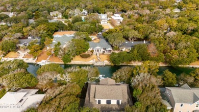 Tucked away on a quiet, canal front cul-de-sac is the home on The Country Club of the Crystal Coast in North Carolina - for sale on GolfHomes.com, golf home, golf lot