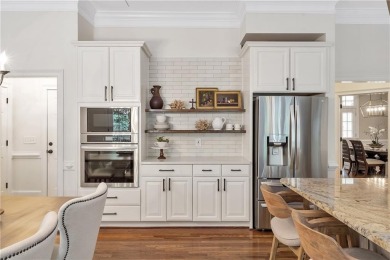 Southern-Inspired Cape Cod Estate on the 15th Hole in Gated on Alpharetta Athletic Club East in Georgia - for sale on GolfHomes.com, golf home, golf lot