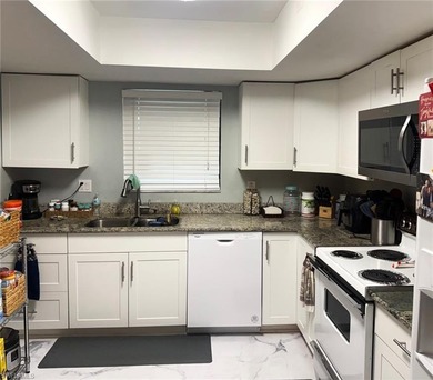 What a nice unit. The building and grounds are spotless!  Common on Hibiscus Golf Club in Florida - for sale on GolfHomes.com, golf home, golf lot