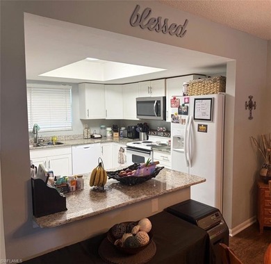 What a nice unit. The building and grounds are spotless!  Common on Hibiscus Golf Club in Florida - for sale on GolfHomes.com, golf home, golf lot