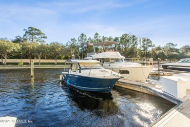 Beautifully FURNISHED 2 bedroom 2 1/2 bath condominium with 50' on Pablo Creek Club in Florida - for sale on GolfHomes.com, golf home, golf lot