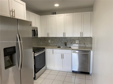 Stunning 2 bed, 2 bath fully updated condo with beautiful lake on Flamingo Lakes Country Club in Florida - for sale on GolfHomes.com, golf home, golf lot