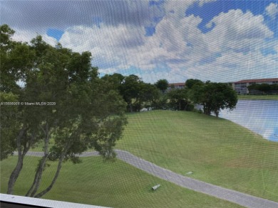 Stunning 2 bed, 2 bath fully updated condo with beautiful lake on Flamingo Lakes Country Club in Florida - for sale on GolfHomes.com, golf home, golf lot
