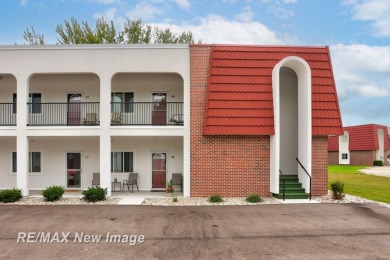Completely Redone in 2023! This stunning first-floor, end unit on Swan Valley Golf Club in Michigan - for sale on GolfHomes.com, golf home, golf lot