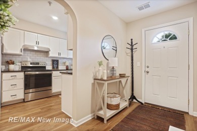 Completely Redone in 2023! This stunning first-floor, end unit on Swan Valley Golf Club in Michigan - for sale on GolfHomes.com, golf home, golf lot