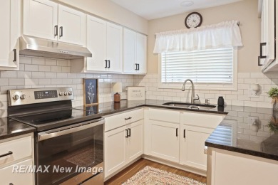 Completely Redone in 2023! This stunning first-floor, end unit on Swan Valley Golf Club in Michigan - for sale on GolfHomes.com, golf home, golf lot
