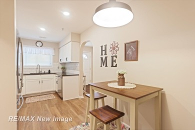 Completely Redone in 2023! This stunning first-floor, end unit on Swan Valley Golf Club in Michigan - for sale on GolfHomes.com, golf home, golf lot