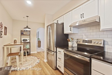 Completely Redone in 2023! This stunning first-floor, end unit on Swan Valley Golf Club in Michigan - for sale on GolfHomes.com, golf home, golf lot