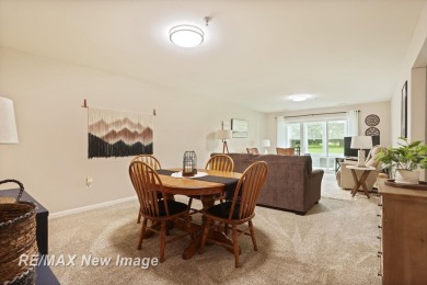 Completely Redone in 2023! This stunning first-floor, end unit on Swan Valley Golf Club in Michigan - for sale on GolfHomes.com, golf home, golf lot