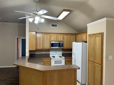 Located in the heart of Runaway Bay, this 4-bedroom, 2-bath home on The Club At Runaway Bay in Texas - for sale on GolfHomes.com, golf home, golf lot