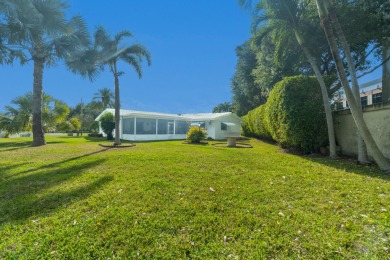 Oversized .21-acre lot with canal access--fish from your on Leisureville Community Golf Course in Florida - for sale on GolfHomes.com, golf home, golf lot