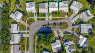 Oversized .21-acre lot with canal access--fish from your on Leisureville Community Golf Course in Florida - for sale on GolfHomes.com, golf home, golf lot