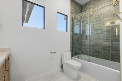 Nestled in guard-gated Eagle Rock community, this stunning home on TPC Las Vegas in Nevada - for sale on GolfHomes.com, golf home, golf lot