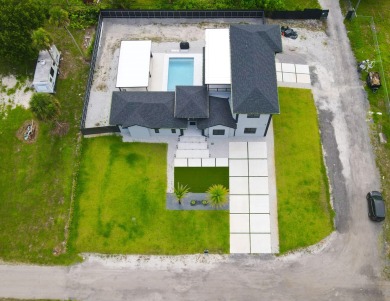 Prepare to be wowed by this magnificent 2-story home on an on Okeeheelee Golf Course in Florida - for sale on GolfHomes.com, golf home, golf lot