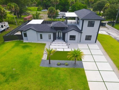 Prepare to be wowed by this magnificent 2-story home on an on Okeeheelee Golf Course in Florida - for sale on GolfHomes.com, golf home, golf lot