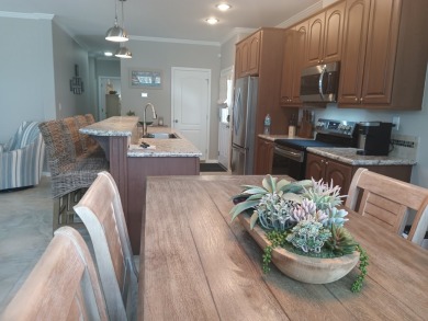 LOCATION! LOCATION!! 3 BEDROOM, 2 BATH (2016 Palm Harbor) -- on Spessard Holland Golf Course in Florida - for sale on GolfHomes.com, golf home, golf lot