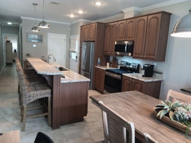 LOCATION! LOCATION!! 3 BEDROOM, 2 BATH (2016 Palm Harbor) -- on Spessard Holland Golf Course in Florida - for sale on GolfHomes.com, golf home, golf lot