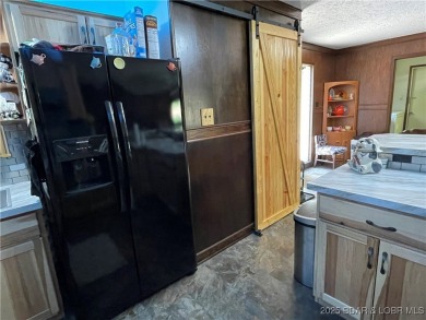 Located down the highly desirable *O* Road in Laurie, this on Indian Rock Golf Club in Missouri - for sale on GolfHomes.com, golf home, golf lot