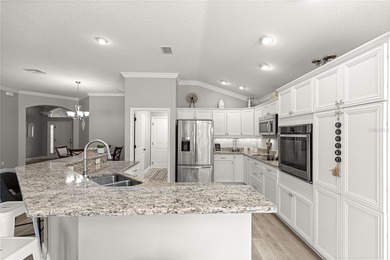 *NEW ROOF (2024)* *GOLF-CART GARAGE* * SOLAR HEATED PRIVATE on Bella Glade Country Club in Florida - for sale on GolfHomes.com, golf home, golf lot