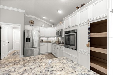 *NEW ROOF (2024)* *GOLF-CART GARAGE* * SOLAR HEATED PRIVATE on Bella Glade Country Club in Florida - for sale on GolfHomes.com, golf home, golf lot