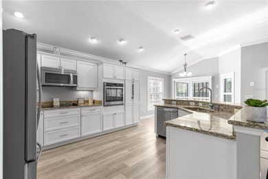 *NEW ROOF (2024)* *GOLF-CART GARAGE* * SOLAR HEATED PRIVATE on Bella Glade Country Club in Florida - for sale on GolfHomes.com, golf home, golf lot