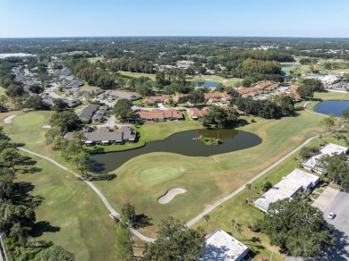 Maintenance Free affordable living in a turnkey condo in the on Seven Springs Golf and Country Club in Florida - for sale on GolfHomes.com, golf home, golf lot