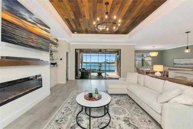 Under contract-accepting backup offers. This Summerville model on Lakewood National Golf Club in Florida - for sale on GolfHomes.com, golf home, golf lot