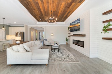 Under contract-accepting backup offers. This Summerville model on Lakewood National Golf Club in Florida - for sale on GolfHomes.com, golf home, golf lot