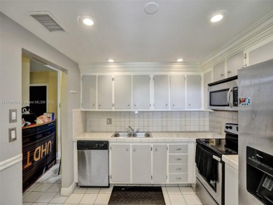 Welcome to your dream condo in the sought-after community of on Woodmont Country Club in Florida - for sale on GolfHomes.com, golf home, golf lot
