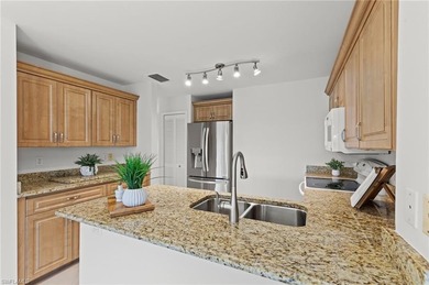 Sweeping lake and golf course views with no buildings beyond on Estero Country Club in Florida - for sale on GolfHomes.com, golf home, golf lot