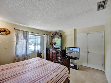 Welcome to your dream condo in the sought-after community of on Woodmont Country Club in Florida - for sale on GolfHomes.com, golf home, golf lot