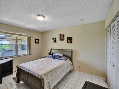 Welcome to your dream condo in the sought-after community of on Woodmont Country Club in Florida - for sale on GolfHomes.com, golf home, golf lot