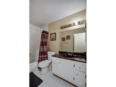 Welcome to your dream condo in the sought-after community of on Woodmont Country Club in Florida - for sale on GolfHomes.com, golf home, golf lot