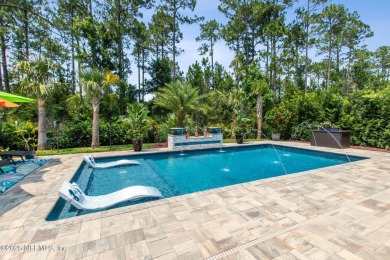 Experience luxury living in this stunning custom home in Amelia on Amelia National Golf and Country Club in Florida - for sale on GolfHomes.com, golf home, golf lot