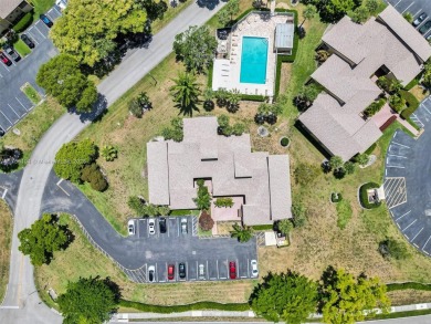 Welcome to your dream condo in the sought-after community of on Woodmont Country Club in Florida - for sale on GolfHomes.com, golf home, golf lot