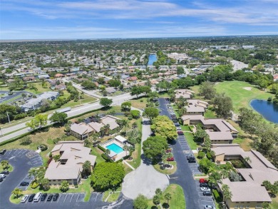 Welcome to your dream condo in the sought-after community of on Woodmont Country Club in Florida - for sale on GolfHomes.com, golf home, golf lot