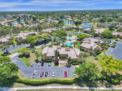 Welcome to your dream condo in the sought-after community of on Woodmont Country Club in Florida - for sale on GolfHomes.com, golf home, golf lot