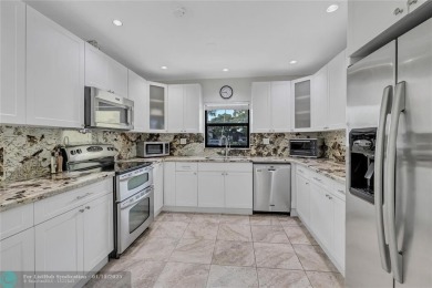 This Charming completely Renovated town home with IMPACT WINDOW on Jacaranda Golf Club in Florida - for sale on GolfHomes.com, golf home, golf lot