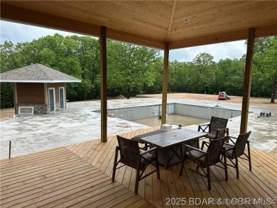 Experience luxury living redefined at The Estates of Kinderhook on The Club At Old Kinderhook in Missouri - for sale on GolfHomes.com, golf home, golf lot