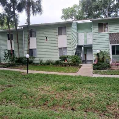 Two bedroom, one and a half bath second floor condominium on Country Club At Silver Springs Shores in Florida - for sale on GolfHomes.com, golf home, golf lot