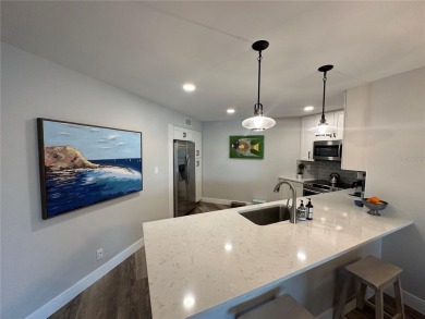 One of the BEST condo remodels in Isla Del Sol!  Photos do not on Isla Del Sol Yacht and Country Club in Florida - for sale on GolfHomes.com, golf home, golf lot