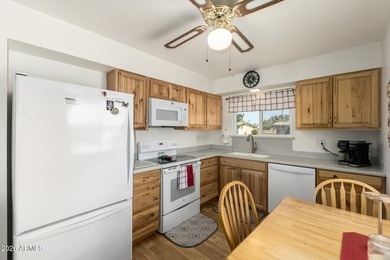 Welcome home to this charming end unit in the active adult Sun on  in Arizona - for sale on GolfHomes.com, golf home, golf lot